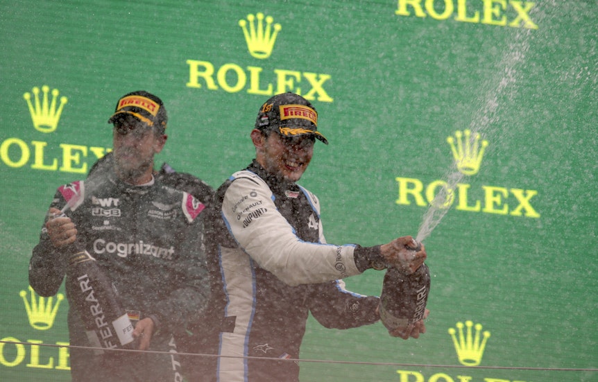 Alpine driver Esteban Ocon of France, right, celebrates on the podium after winning with second placed Aston Martin driver Sebastian Vettel of Germany after the Hungarian Formula One Grand Prix, at the Hungaroring racetrack in Mogyorod, Hungary, Sunday, Aug. 1, 2021. (Florion Goga/Pool via AP)