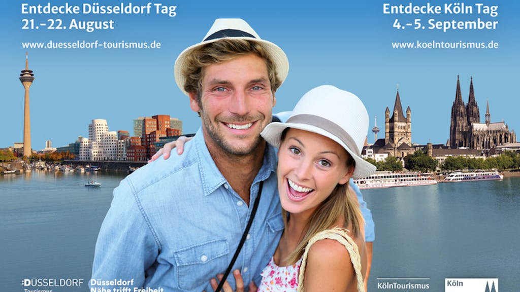 Köln und Düsseldorf machen gemeinsam Werbung mit einem Pärchen vor den Stadt-Panoramen für Tourismus in den Städten.&nbsp;