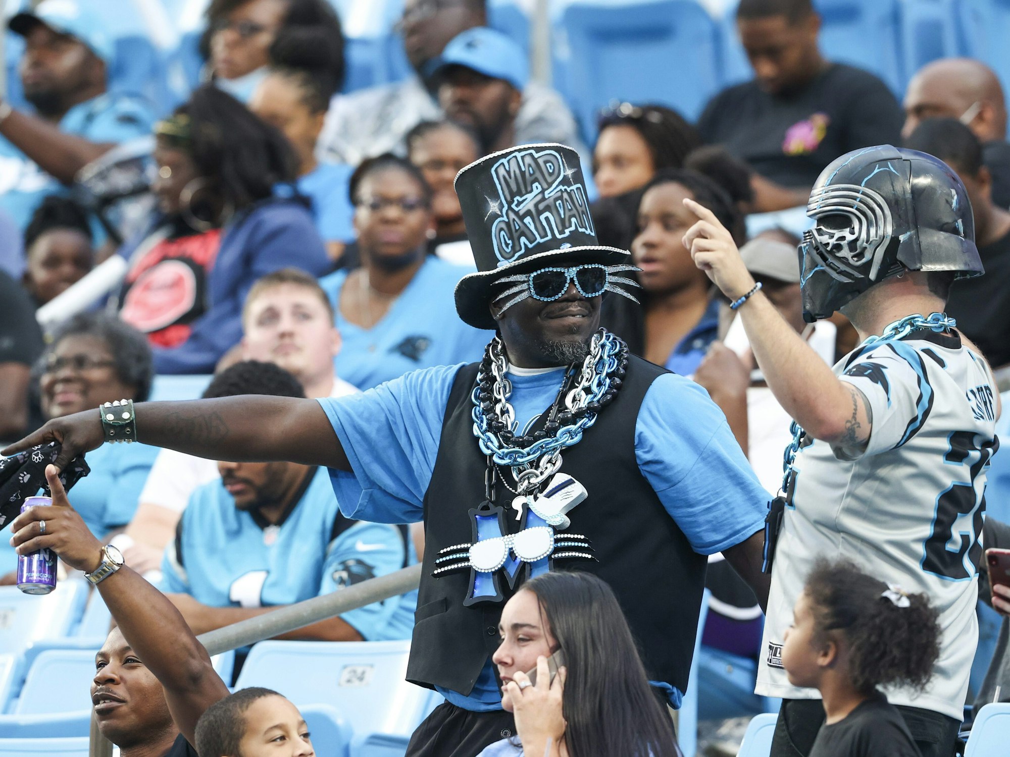Carolina Panthers fans enjoy Fan Fest at the NFL football team's training camp in Charlotte, N.C., Friday, Aug. 6, 2021. (AP Photo/Nell Redmond)