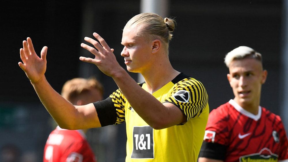 Dortmund's Norwegian forward Erling Braut Haaland reacts during the German first division Bundesliga football match SC Freiburg v Borussia Dortmund in Freiburg, southwestern Germany on August 21, 2021. (Photo by Thomas KIENZLE / AFP) / DFL REGULATIONS PROHIBIT ANY USE OF PHOTOGRAPHS AS IMAGE SEQUENCES AND/OR QUASI-VIDEO