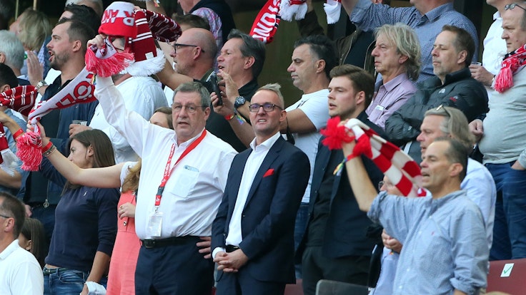 Werner Wolf and Alexander Wehrle stand in the stands during the Bundesliga match between 1. FC Cologne and RB Leipzig.