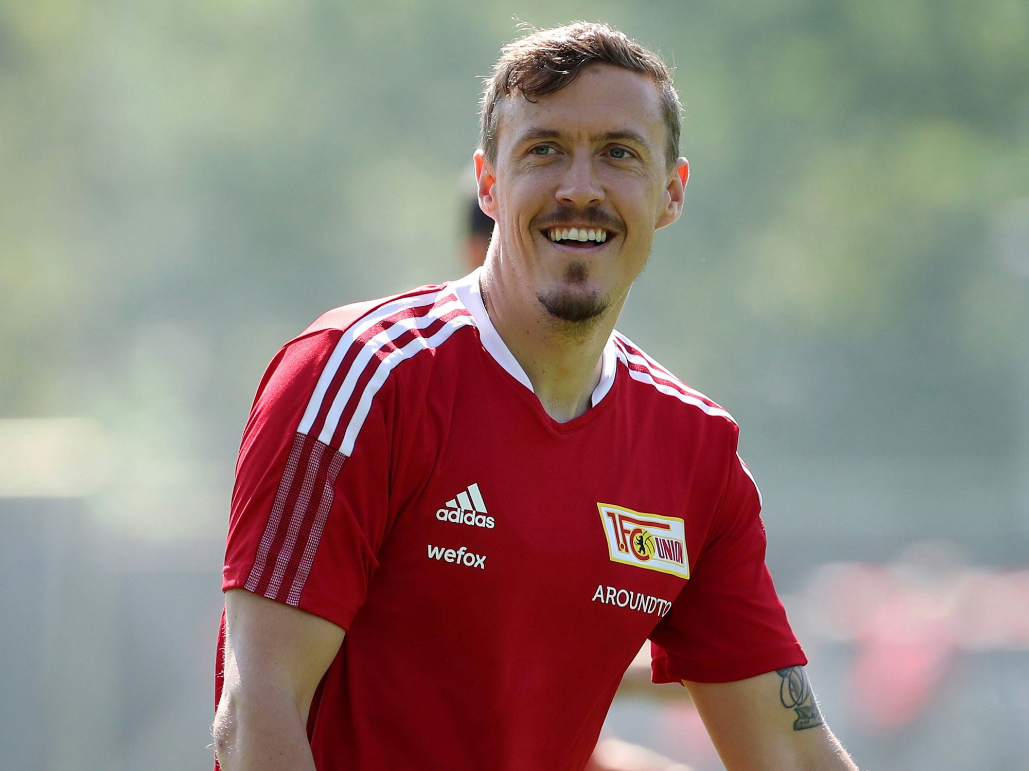 Max Kruse lacht im Training des 1. FC Union Berlin am 06. Juli 2021
