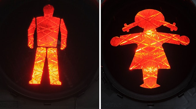 Ampelmann und Ampelfrau leuchten rot (links)