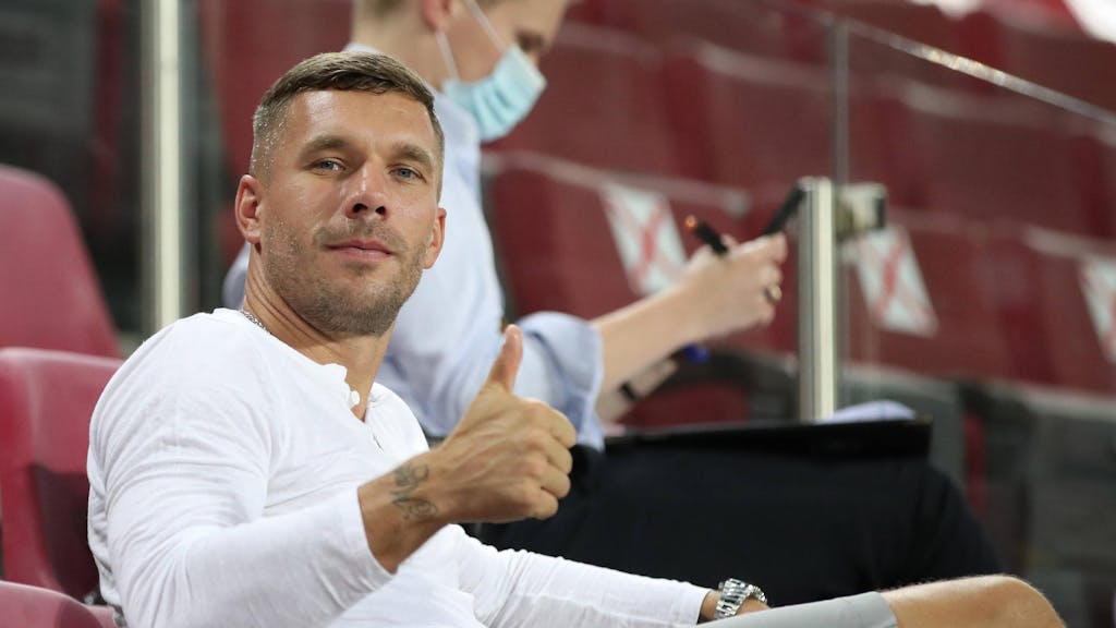 COLOGNE, GERMANY - AUGUST 16: Former German international footballer Lukas Podolski looks on during the UEFA Europa League Semi Final between Sevilla and Manchester United at RheinEnergieStadion on August 16, 2020 in Cologne, Germany. 