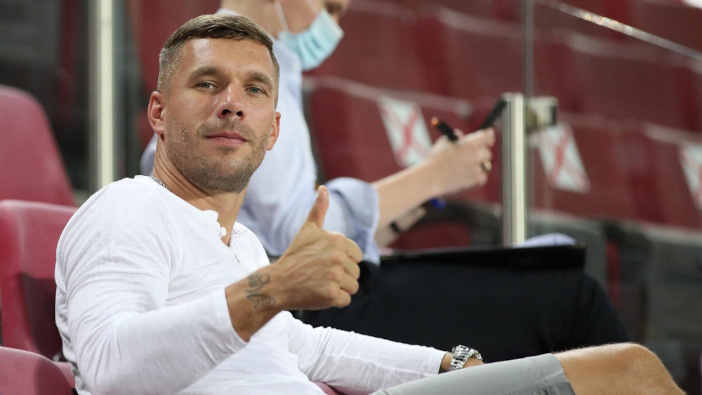 COLOGNE, GERMANY - AUGUST 16: Former German international footballer Lukas Podolski looks on during the UEFA Europa League Semi Final between Sevilla and Manchester United at RheinEnergieStadion on August 16, 2020 in Cologne, Germany.