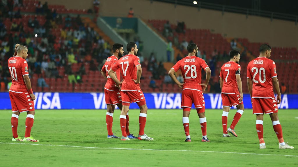 Tunisia's players react after Burkina Faso scored during the Africa Cup of Nations (CAN) 2021 quarter final football match between Burklina Faso and Tunisia at Stade Roumde Adjia in Garoua on January 29, 2022. (Photo by Daniel BELOUMOU OLOMO / AFP)