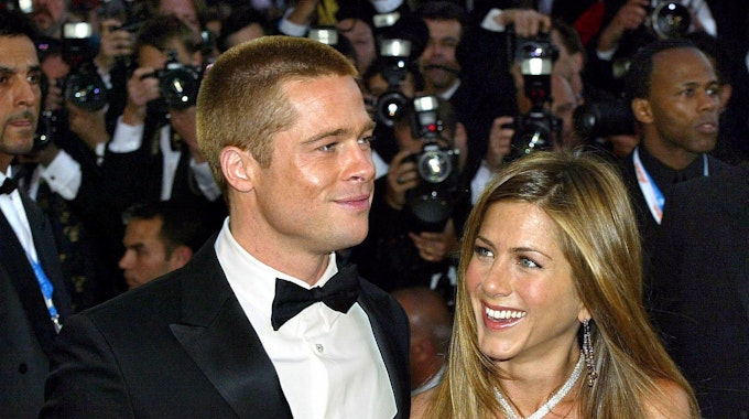 Actors Brad Pitt (L) and Jennifer Aniston arriving on the red carpet at the Palais des Festivals during the Cannes 57th international film festival of Cannes for the screening of their film Troy, directed by Wolfgang Petersen, Cannes, 13 May 2004.