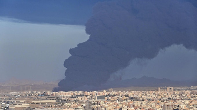 Smoke billows from an oil storage facility in Saudi Arabia's Red Sea coastal city of Jeddah on March 25, 2022. (Photo by ANDREJ ISAKOVIC / AFP)