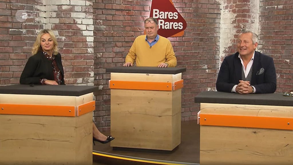 Zu sehen sind die ZDF-Händler und Händlerinnen Susanne Steiger, Walter Lehnertz und Markus Wildhagen in der „Bares für Rares“-Folge vom Dienstag.