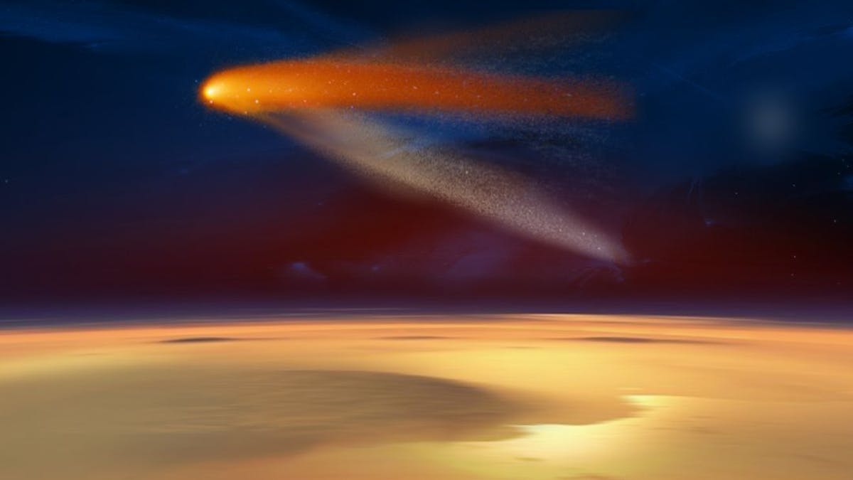 Das undatierte Bild der Nasa zeigt illustrativ, wie der Komet „Siding Spring“ in Rekordnähe am Mars vorbeiflog. Der Schweifstern passierte den Mars in nur knapp 140.000 Kilometer Entfernung.