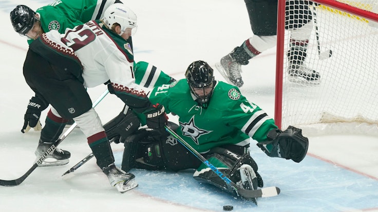Arizona Coyotes center Nathan Smith (13) tries to score against Dallas Stars goaltender Scott Wedgewood (41) and defenseman Jani Hakanpaa (2) during the first period of an NHL hockey game in Dallas, Wednesday, April 27, 2022. (AP Photo/LM Otero)