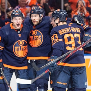 Edmonton Oilers' Zach Hyman (18), Leon Draisaitl (29) and Ryan Nugent-Hopkins (93) celebrate a goal against the Los Angeles Kings during the second period of Game 2 of an NHL hockey Stanley Cup playoffs first-round series Wednesday, May 4, 2022, in Edmonton, Alberta. (Jason Franson/The Canadian Press via AP)