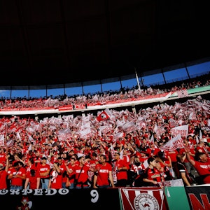 BERLIN, GERMANY - MAY 21: SC Freiburg fans show their support prior to the final match of the DFB Cup 2022 between SC Freiburg and RB Leipzig at Olympiastadion on May 21, 2022 in Berlin, Germany. (Photo by Dean Mouhtaropoulos/Getty Images)