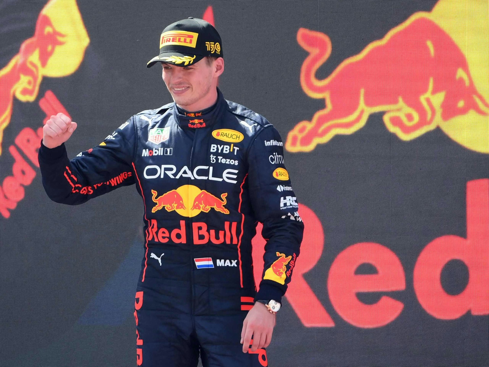 Red Bull's Dutch driver Max Verstappen celebrates on the podium after winning the Spanish Formula One Grand Prix at the Circuit de Catalunya on May 21, 2022 in Montmelo, on the outskirts of Barcelona. (Photo by LLUIS GENE / AFP)
