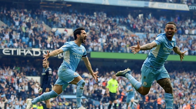 MANCHESTER, ENGLAND - MAY 22: Ilkay Guendogan of Manchester City celebrates after scoring their team's third goal during the Premier League match between Manchester City and Aston Villa at Etihad Stadium on May 22, 2022 in Manchester, England. (Photo by Michael Regan/Getty Images)