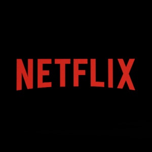 Roter Schriftzug von Netflix vor schwarzem Hintergrund.