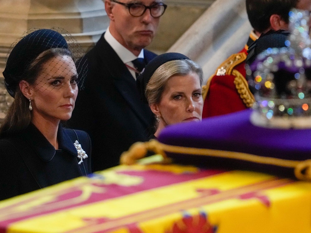 Britain's Kate, Princess of Wales, left, and Sophie, Countess of Wessex watch the coffin of Queen Elizabeth arrive in Westminster Hall, London, Wednesday, Sept. 14, 2022. The Queen will lie in state in Westminster Hall for four full days before her funeral on Monday Sept. 19. (AP Photo/Gregorio Borgia, Pool)