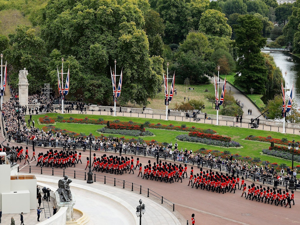 Coldstream Guards proceed down The Mall ahead of The State Funeral of Queen Elizabeth II, in London, Monday, Sept. 19, 2022. (Chip Somodevilla/Pool Photo via AP)