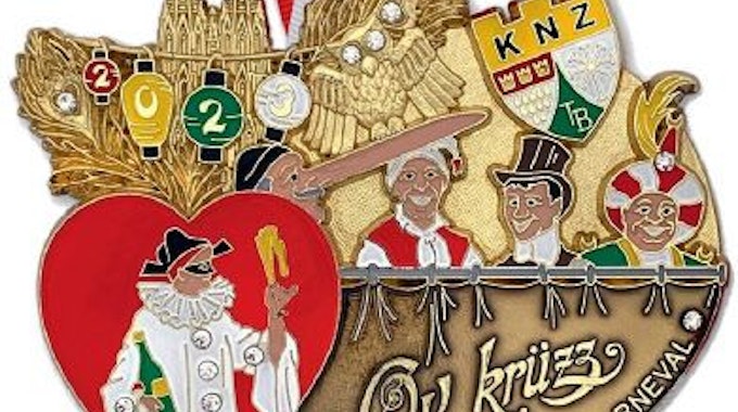 Orden der Kölner Narren-Zunft, der dem Notendeckblatt des „Allgemeinen Karnevals-Marschlieds“ aus dem Jahr 1905 nachempfunden ist