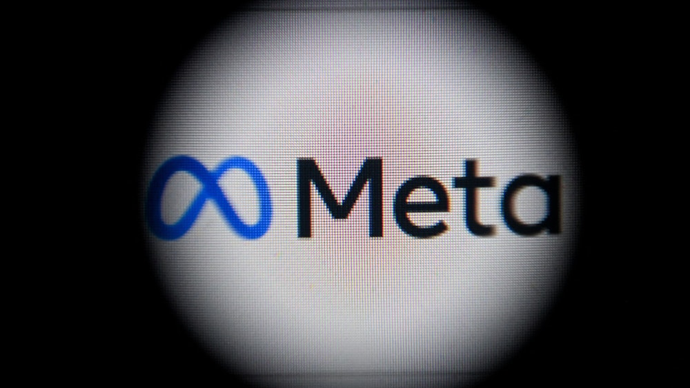 Das Meta-Logo auf einem Computerbildschirm, umrandet von einem schwarzem Kreis.