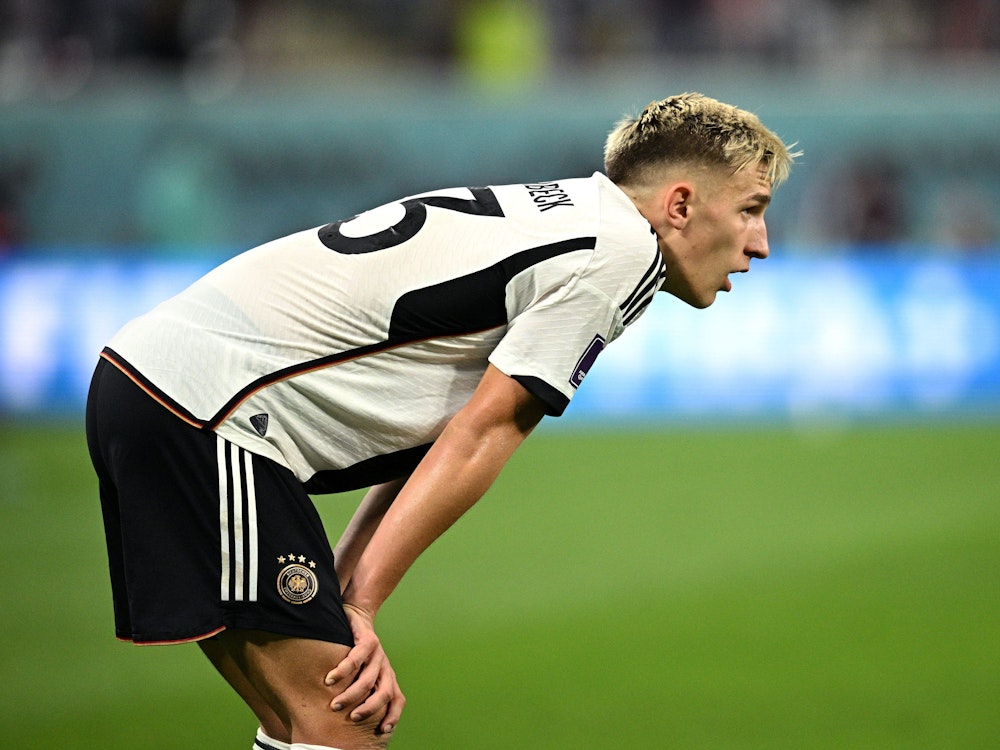 DOHA, QATAR - NOVEMBER 23: Nico Schlotterbeck of Germany show dejection after the 1-2 defeat in the FIFA World Cup Qatar 2022 Group E match between Germany and Japan at Khalifa International Stadium on November 23, 2022 in Doha, Qatar. (Photo by Stuart Franklin/Getty Images)