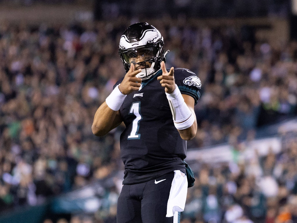 Quarterback Jalen Hurts of the Philadelphia Eagles celebrates after scoring for his team in an NFL game against the Green Bay Packers in 2022.  November 27