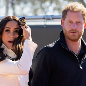 FILE - Prince Harry and Meghan Markle, Duke and Duchess of Sussex visit the track and field event at the Invictus Games in The Hague, Netherlands, Sunday, April 17, 2022. Prince Harry and his wife, Meghan, are expected to vent their grievances against the monarchy when Netflix releases the final episodes of a series about the couple’s decision to step away from royal duties and make a new start in America. (AP Photo/Peter Dejong, File)