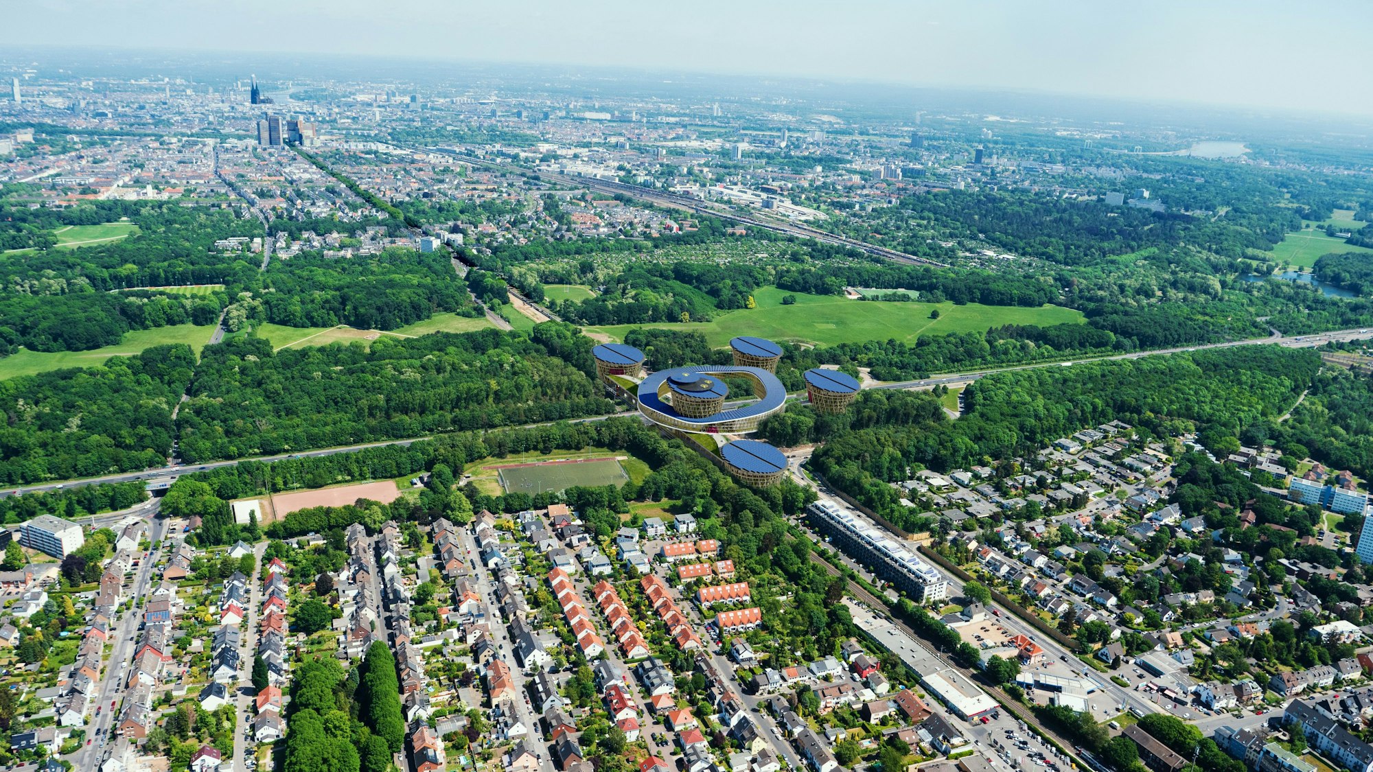 Die Visualisierung zeigt das geplante Mobilitätszentrum über der Autobahn 4 von oben, im Hintergrund ist Köln zu sehen.