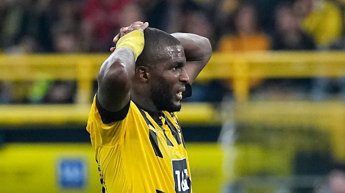 Dortmund's Anthony Modeste reacts after he missed to score during the German Bundesliga soccer match between Borussia Dortmund and TSG Hoffenheim in Dortmund, Germany, Friday, Sept. 2, 2022. (AP Photo/Martin Meissner)