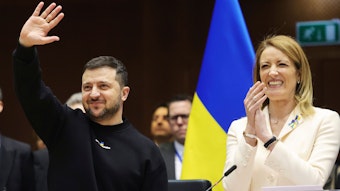 Ukraine's President Volodymyr Zelenskyy, centre, gestures as European Parliament's President Roberta Metsola, right, applauds during an EU summit at the European Parliament in Brussels, Belgium, Thursday, Feb. 9, 2023. On Thursday, Zelenskyy will join EU leaders at a summit in Brussels, which German Chancellor Olaf Scholz described as a "signal of European solidarity and community." (AP Photo/Olivier Matthys)
