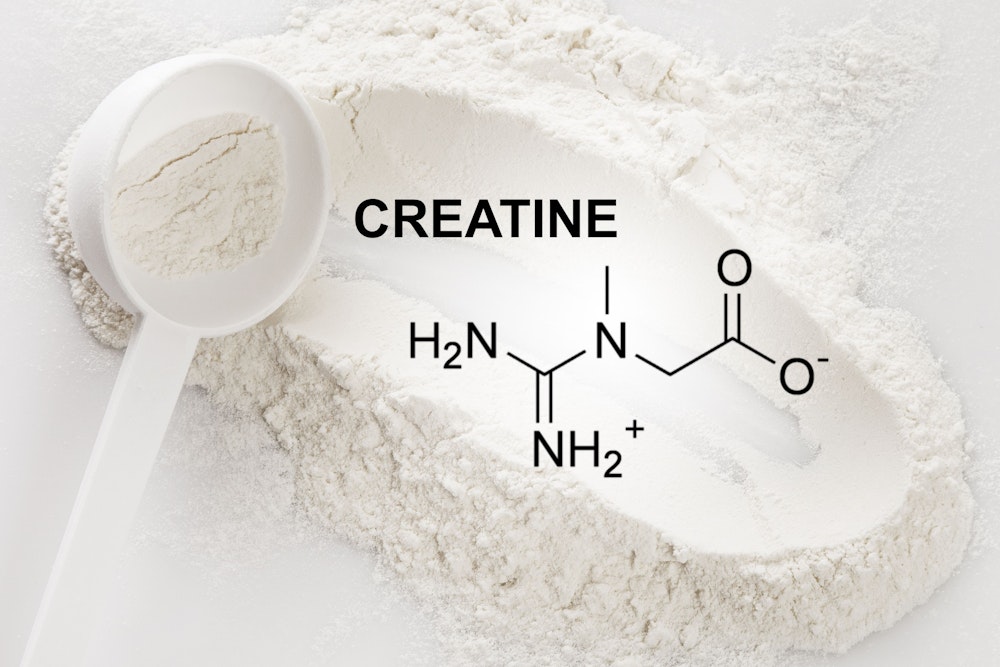Closeup of scoop with creatine monohydrate supplement and chemical formula