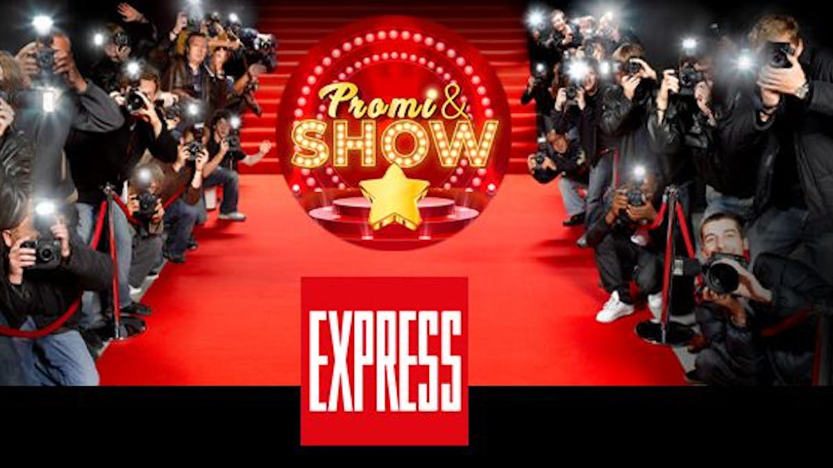 Fotografen am roten Teppich, auf dem das Logo des EXPRESS und von Promi &amp; Show zu sehen sind.