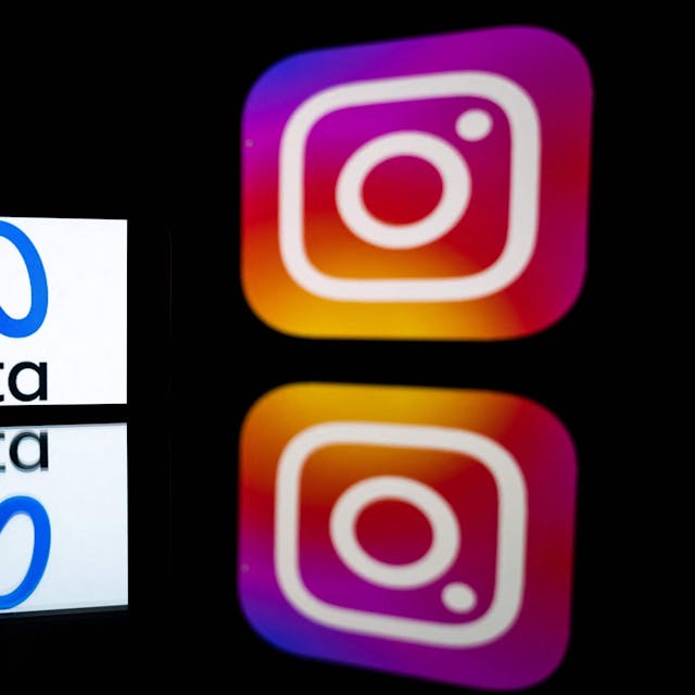 Diese Datei-Illustration zeigt ein Smartphone und einen Computerbildschirm mit den Logos der Instagram-App und des Mutterunternehmens Meta.
