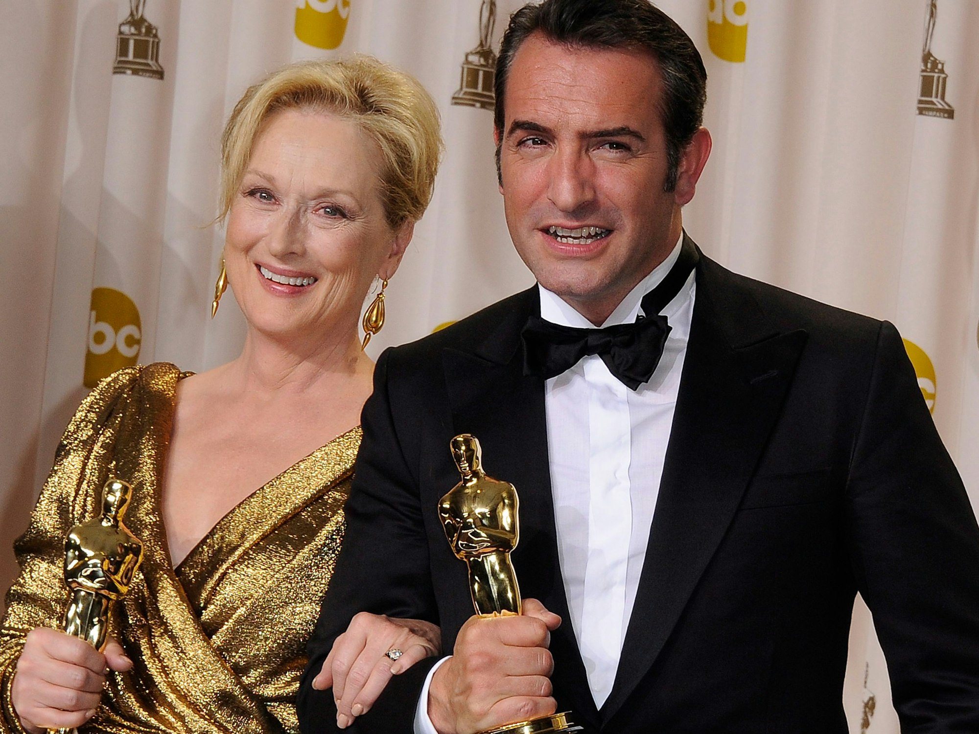 Jean Dujardin und seine US-Kollegin Meryl Streep mit Oscars.