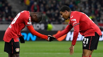 Leverkusen's Amine Adli celebrates with Moussa Diaby, left, after scoring his side's second goal during the Europa League round of 16, 2nd leg, soccer match between Ferencvaros and Bayer 04 Leverkusen at the Puskas Arena in Budapest, Thursday, March 16, 2023. (AP Photo/Denes Erdos)