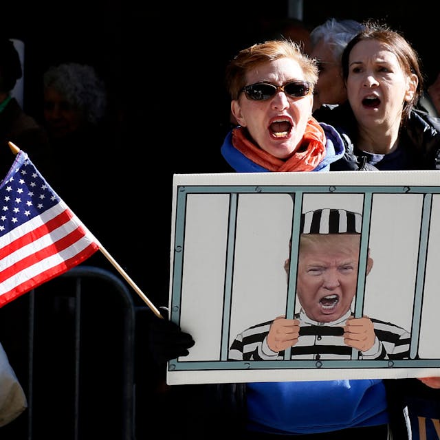 Anti-Trump demonstrators protest outside the Manhattan District Attorney's office in New York City on March 21, 2023