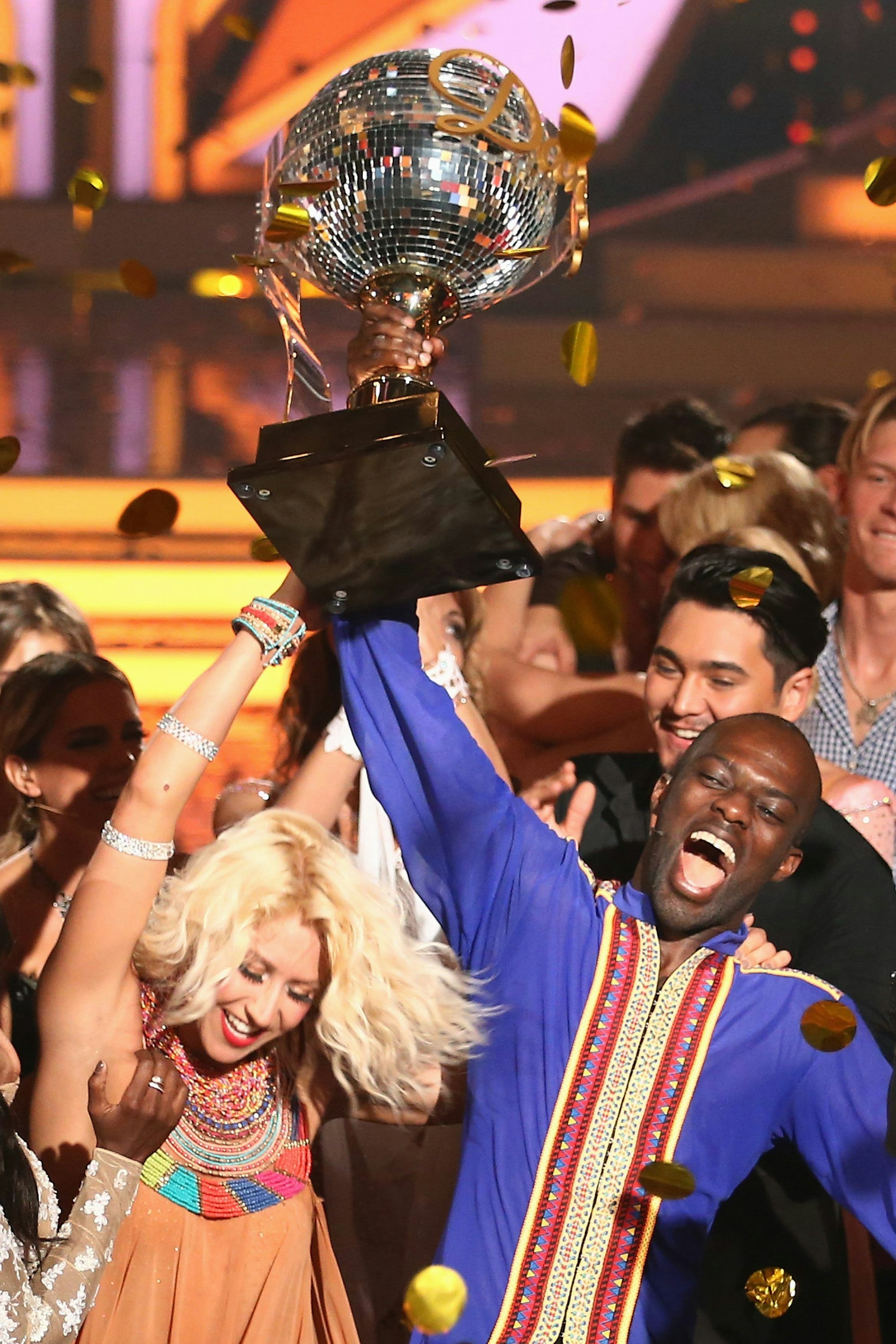 COLOGNE, GERMANY - JUNE 05:  Hans Sarpei and Kathrin Menzinger celebrate after winning the award during the final show of the television competition 'Let's Dance' on June 5, 2015 in Cologne, Germany.  (Photo by Andreas Rentz/Getty Images)