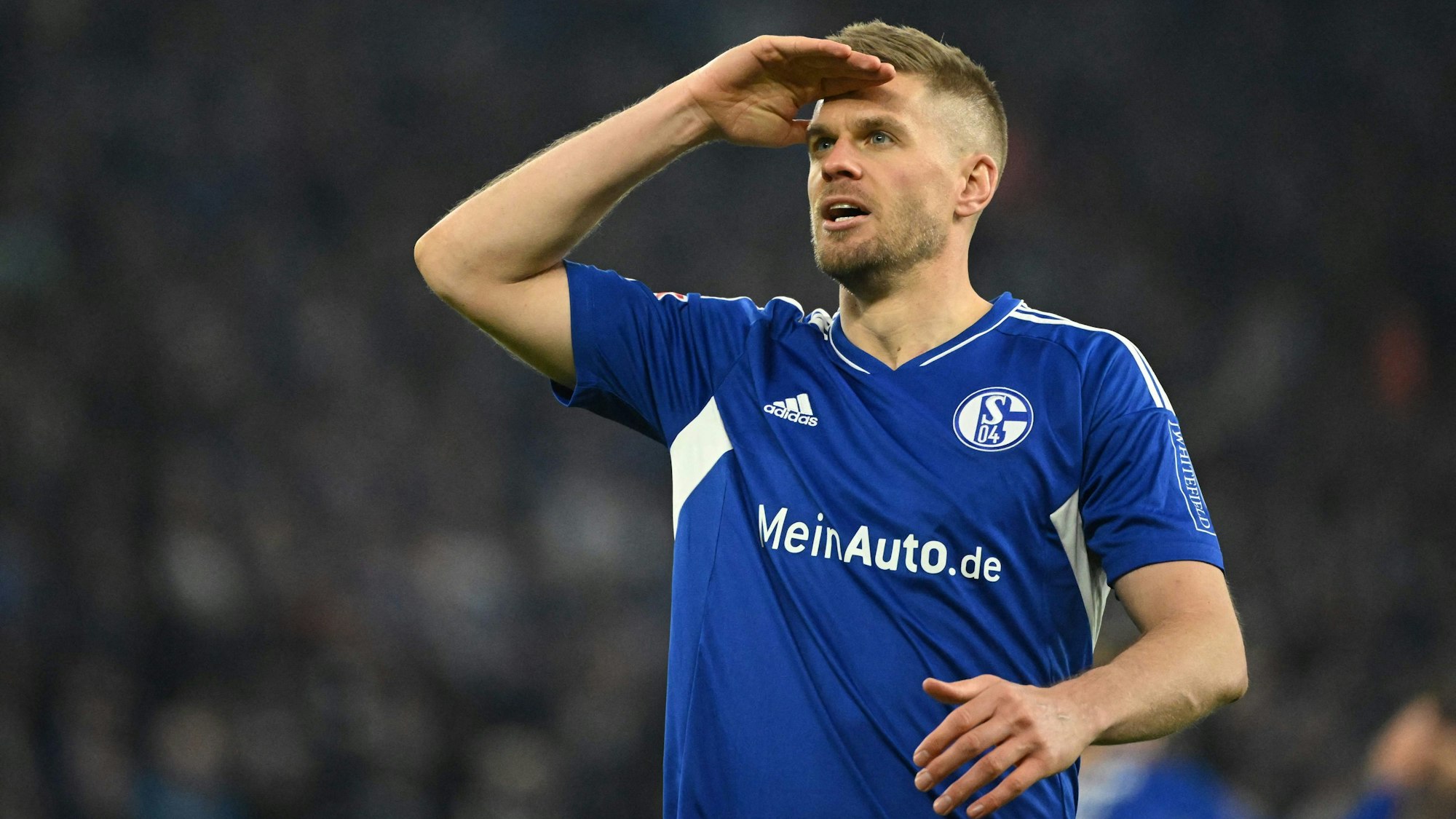 Schalke's German forward Simon Terodde celebrates scoring the 3-1 goal during the German first division Bundesliga football match between FC Schalke 04 and Hertha Berlin in Gelsenkirchen, western Germany, on April 14, 2023. (Photo by INA FASSBENDER / AFP) / DFL REGULATIONS PROHIBIT ANY USE OF PHOTOGRAPHS AS IMAGE SEQUENCES AND/OR QUASI-VIDEO
