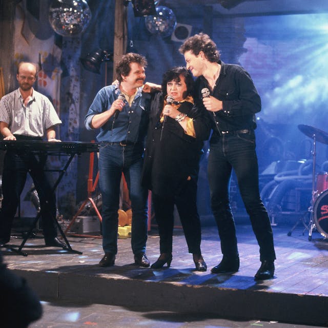 Die Musiker Tommy Engel, Trude Herr und Wolfgang Niedecken bei einem gemeinsamen Auftritt im Jahre 1987.