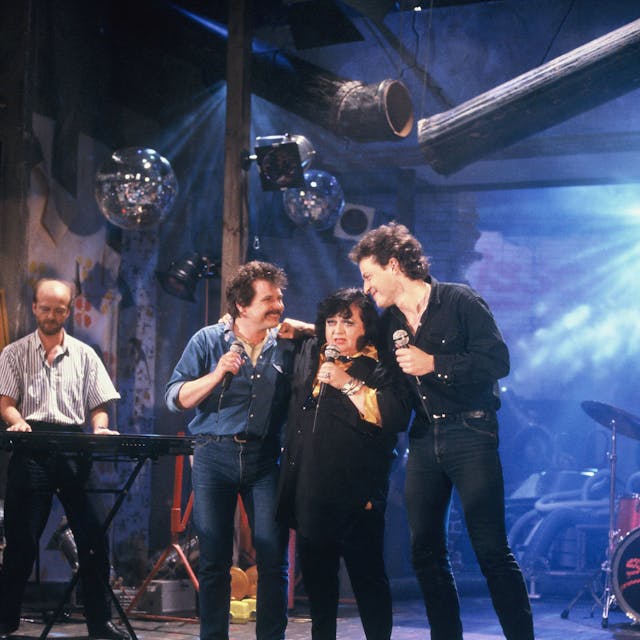 Die Musiker Tommy Engel, Trude Herr und Wolfgang Niedecken bei einem gemeinsamen Auftritt im Jahre 1987.