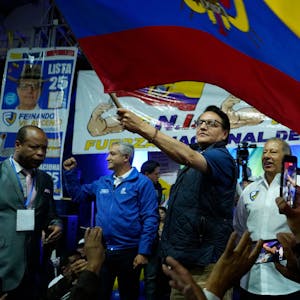 FILE - Presidential candidate Fernando Villavicencio waves a national flag during a campaign event at a school minutes before he was shot to death outside the same school, in Quito, Ecuador, Aug. 9, 2023. Villavicencio was fatally shot in broad daylight despite a security detail that included police and bodyguards. (API via AP File)