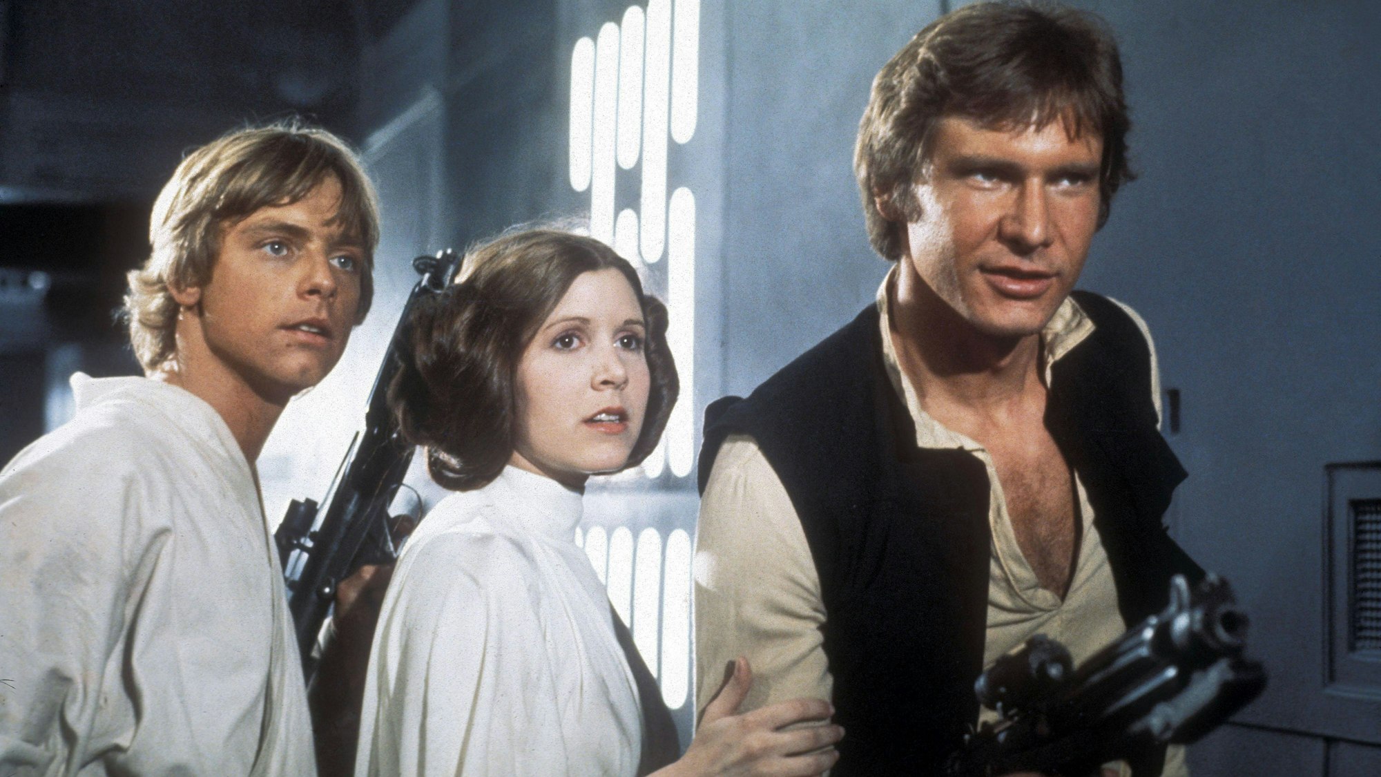 Mark Hamill, Carrie Fisher und Harrison Ford als Luke, Leia und Han Solo in „Star Wars IV – Eine neue Hoffnung“.