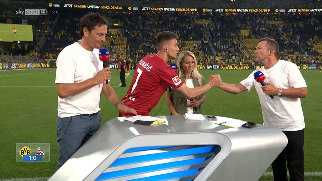 Lothar Matthäus und Dejan Ljubicic nach dem Topspiel zwischen Borussia Dortmund und dem 1. FC Köln im Signal-Iduna-Park beim Handshake. Daneben stehen Sebastian Hellmann und Julia Simic.
