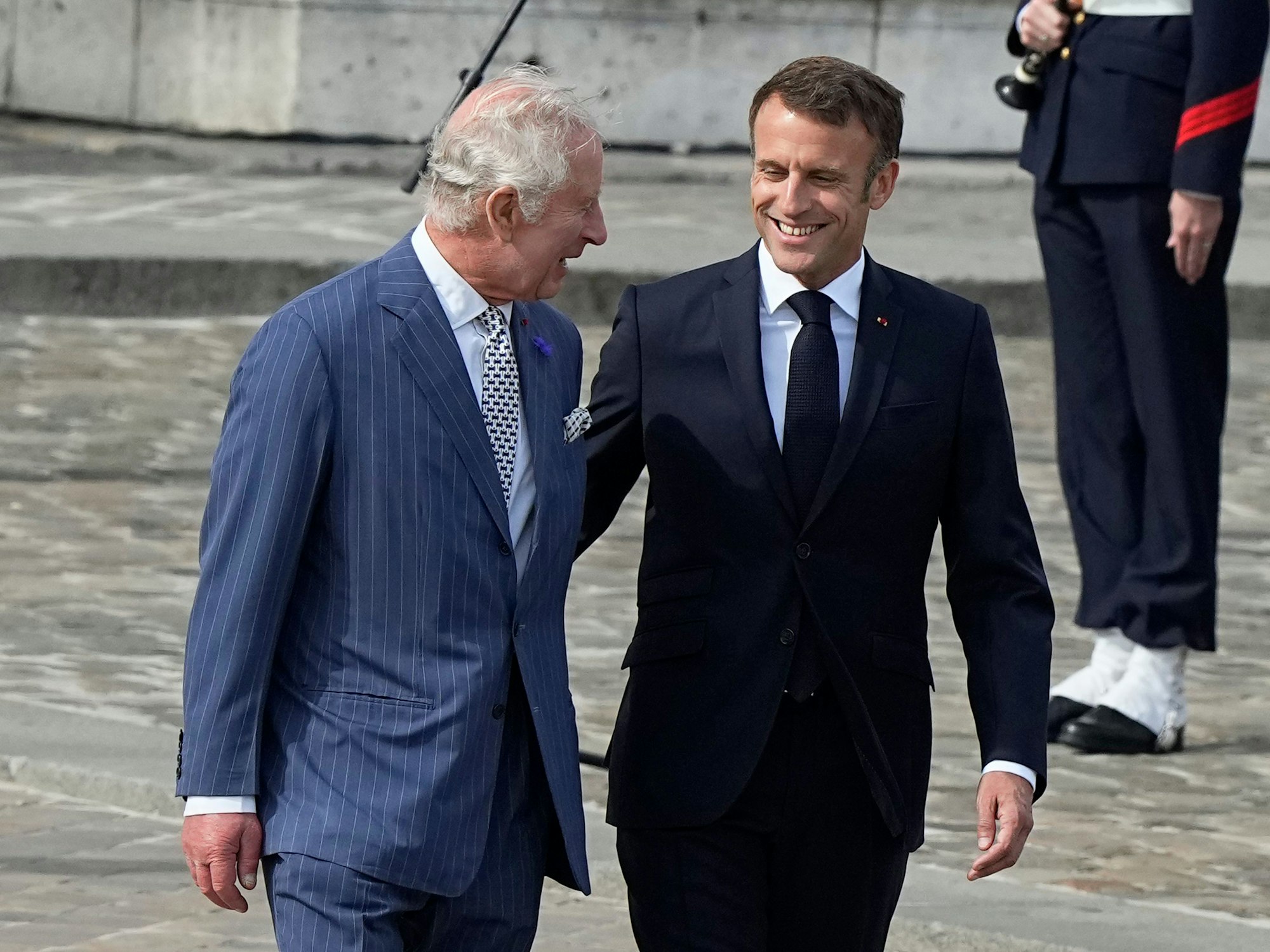 French President Emmanuel Macron, right, and Britain's King Charles III attend a ceremony at the Arc de Triomphe, Wednesday, Sept. 20, 2023 in Paris. King Charles III of the United Kingdom starts a three-day state visit to France on Wednesday meant to highlight the friendship between the two nations with great pomp, after the trip was postponed in March amid widespread demonstrations against President Emmanuel Macron's pension changes. (AP Photo/Michel Euler)
