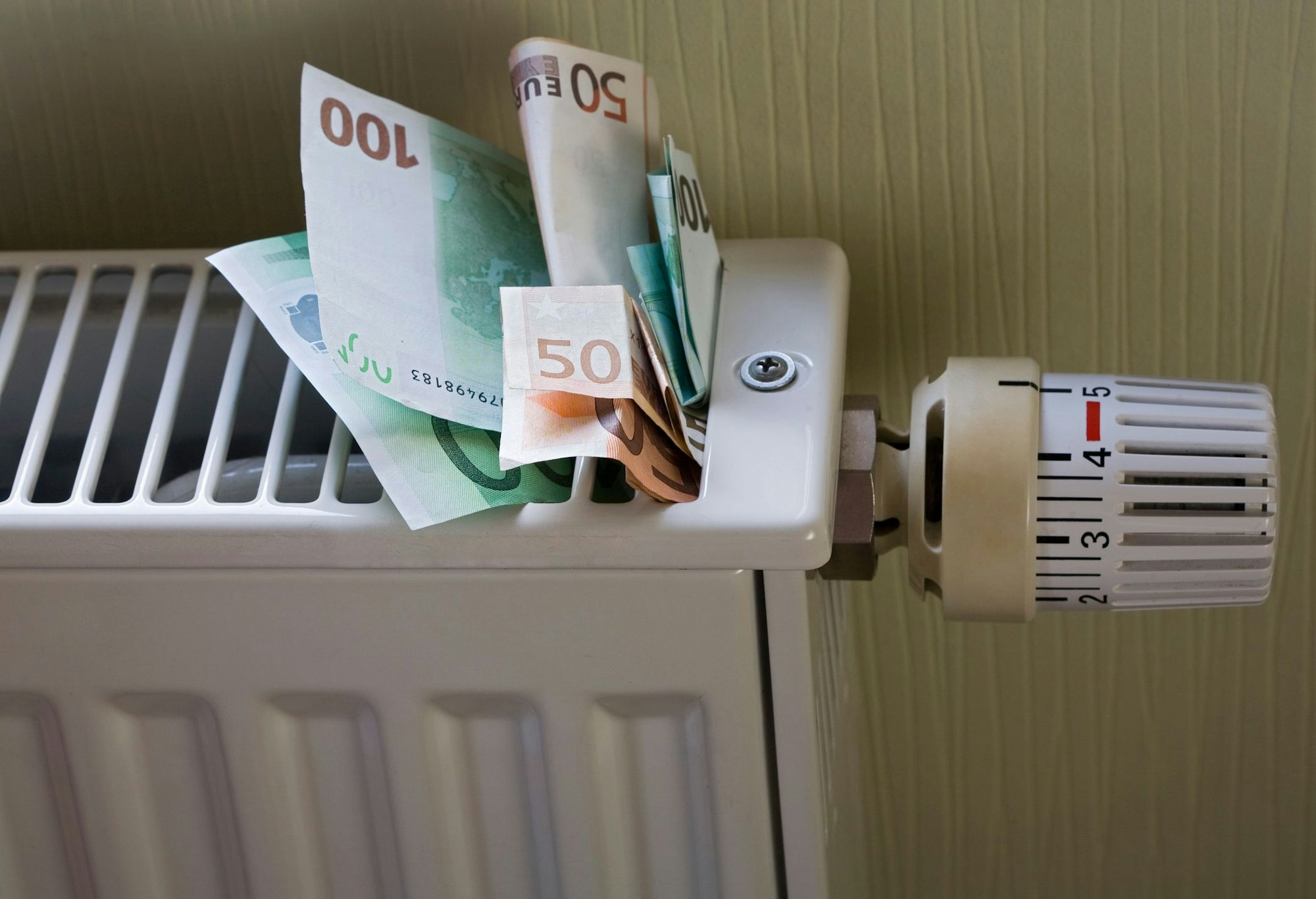 Euro banknotes stuck in a radiator
