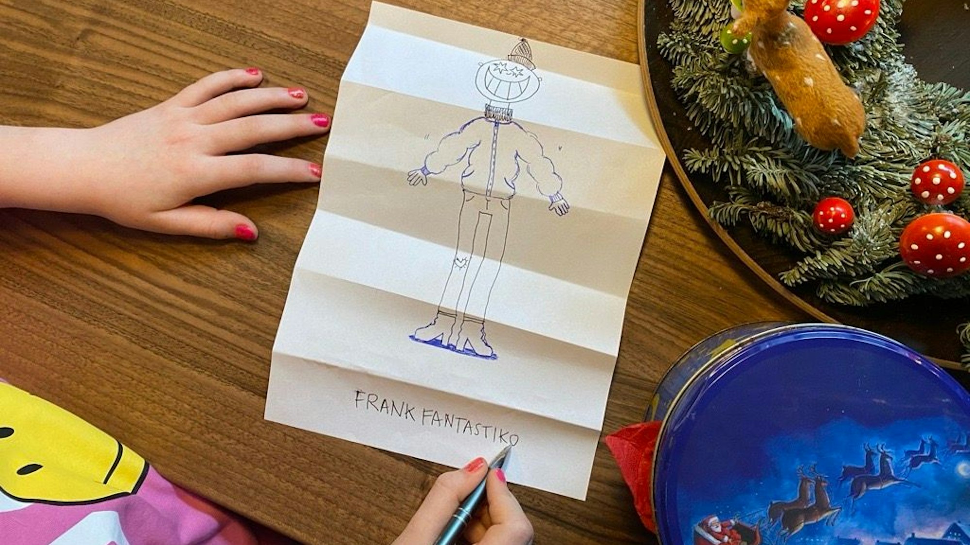 Ein Kind malt ein Knickbild