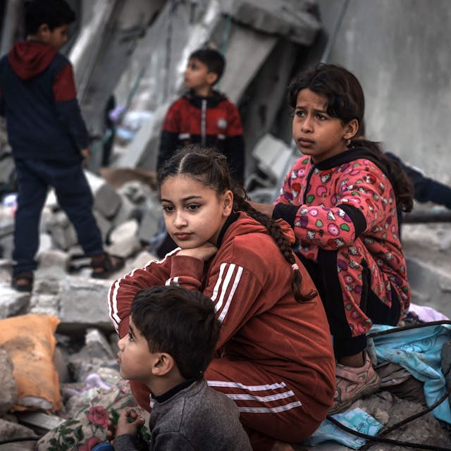 Children sit amid the rubble of destroyed buildings following Israeli bombardment in Rafah on the southern Gaza Strip on December 29, 2023, amid the ongoing battles between Israel and the Palestinian militant group hamas. (Photo by AFP)