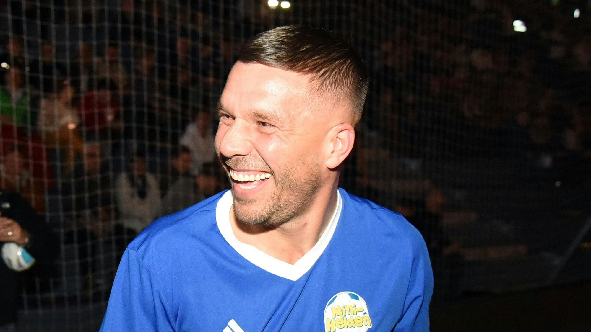 Lukas Podolski lacht.