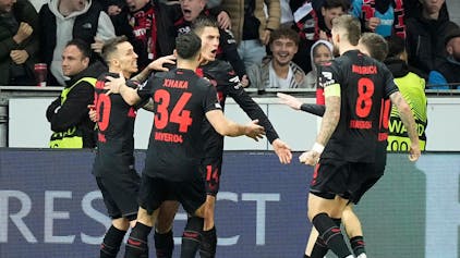 Leverkusen's Patrik Schick, 3rd from left, celebrates after scoring his side's second goal during the Europa League round of sixteen, second leg, soccer match between Bayer Leverkusen and Qarabag FK at the BayArena in Leverkusen, Germany, Thursday, March 14, 2024. (AP Photo/Martin Meissner)