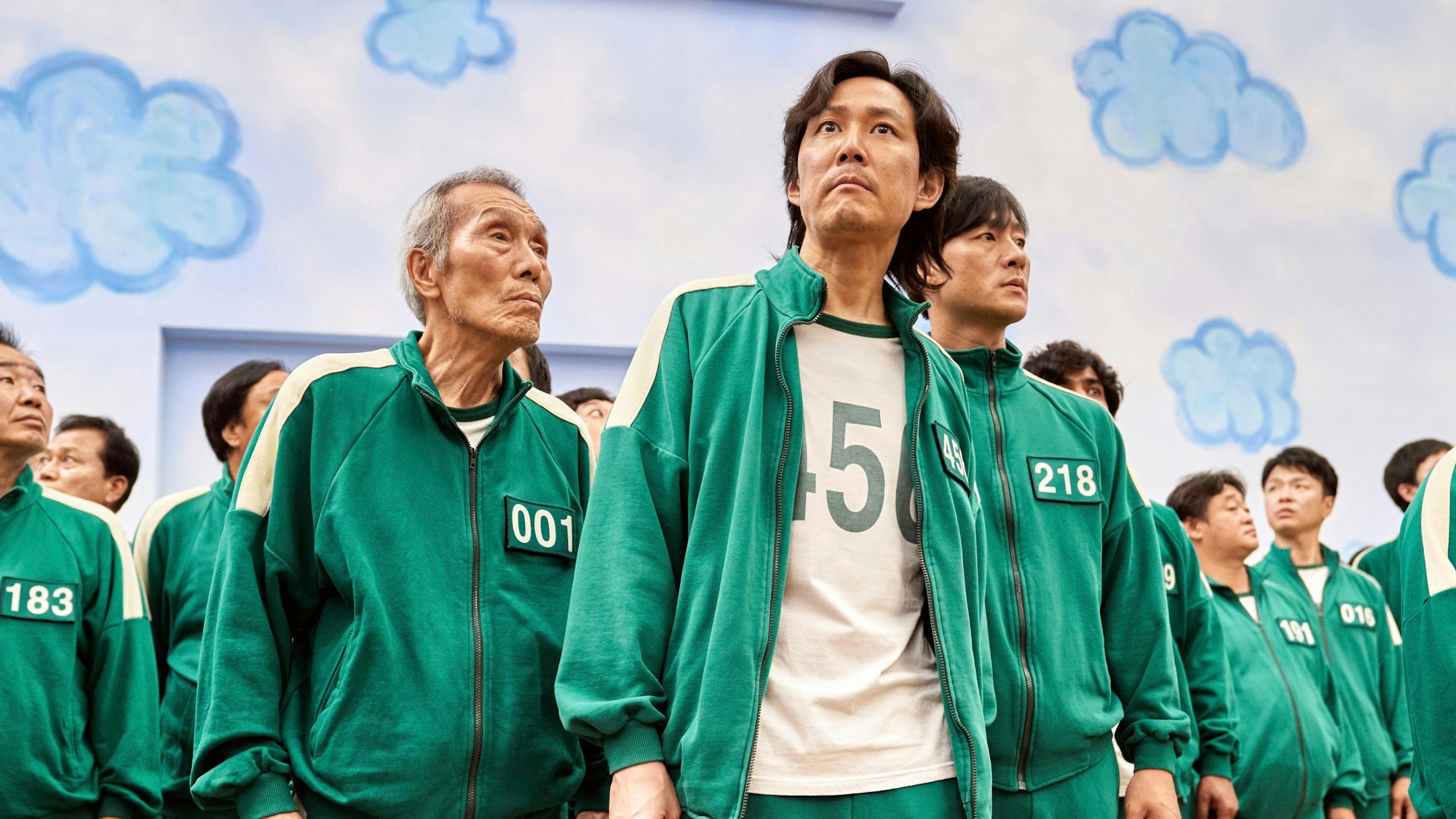 This image released by Netflix shows Lee Jung-jae, center, Park Hae-soo, right, and Oh Young-soo in a scene from the Korean series "Squid Game." (Netflix via AP)